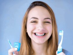 young woman oral hygiene with braces timonium md